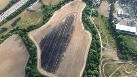 Surrey Fire and Rescue An aerial shot of the farm, showing a huge scorched area