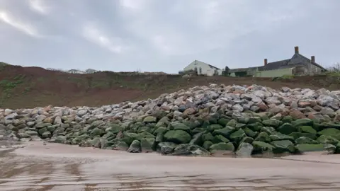 Daniel Mumby Anchor's Drop and the new flood defences seen from the shoreline