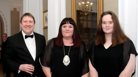 Derbyshire Law Centre Lisa Haythorne with her husband Stephen Haythorne and daughter Hannah Haythorne