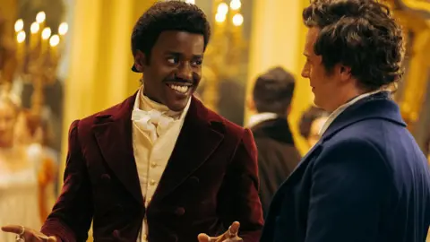 James Pardon/Bad Wolf/BBC Studios The Doctor encounters Rogue (Jonathan Groff) at the Duchess of Pemberton's ball.