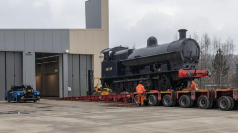 Locomotive Super D is unloaded into New Hall