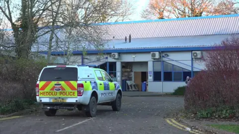 Police vehicle outside Teledyne Labtech factory in Presteigne in Powys