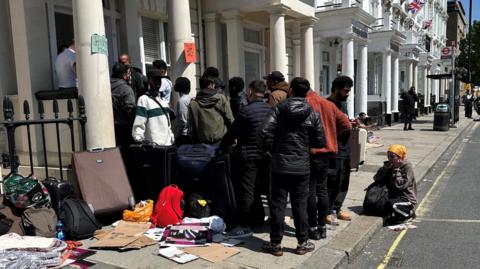 Asylum seekers outside hotel