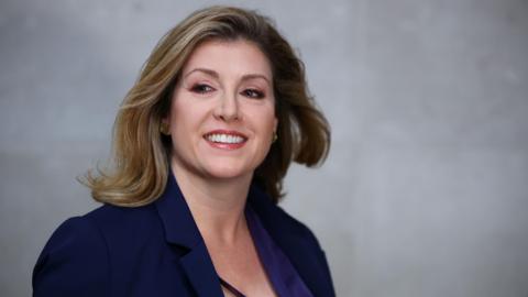 Penny Mordaunt with a blow-dry wearing a purple jacket