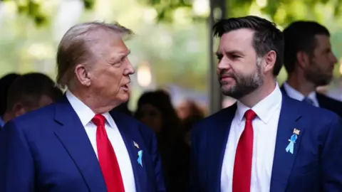 Donald Trump and JD Vance stand together facing each other outdoors