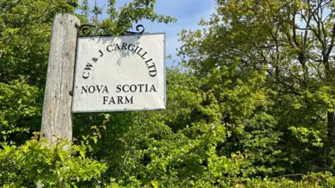 Andrew Turner/BBC Sign outside Nova Scotia Farm