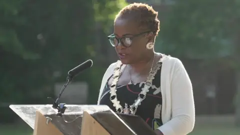 Mayor of Reading Alice Mpofu-Coles speaking at a lectern.