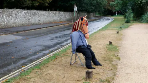 Martin Parr-Magnum Photos A horse scarecrow by the side of a road