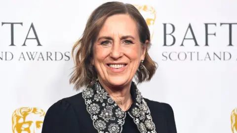 Getty Images Kirsty Wark wearing a black dress while attending the 2023 BAFTA Scotland Awards