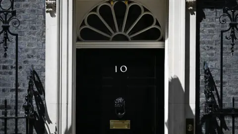 Reuters The frontdoor of 10 Downing Street showing the railings on either side
