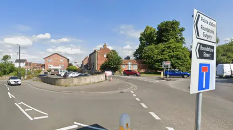 The entrance of The Halve and Roundstone Street in Trowbridge seen from a roundabout.