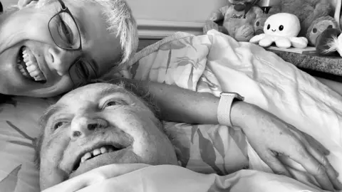 Supplied Amanda cuddling David