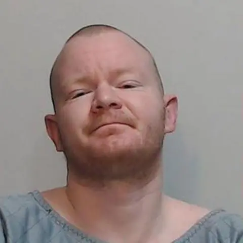 Police Scotland A police picture of a man with short red hair and a slight growth of red beard