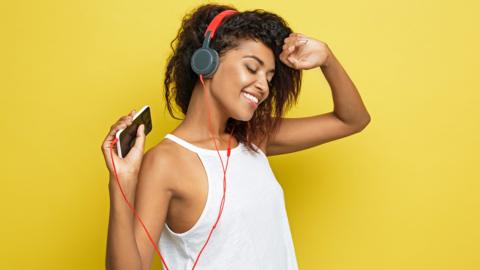 Woman dancing with headphones on