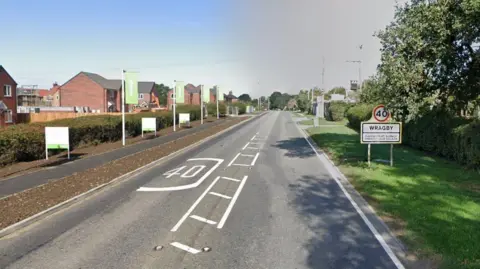 Google A Google Maps shot of Horncastle Road. There is a new estate on the left of the road and a white sign saying "40" above "Wragby".