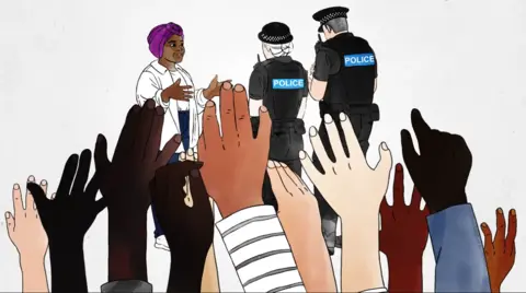 An animated screen grab from the video with a row of hands at the front of the image and two police officers questioning a woman in the background