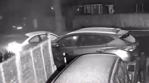 Two cars facing each other in the road after a collision