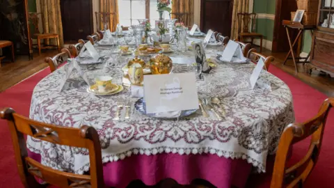 A dining table set up for tea in Preston Manor