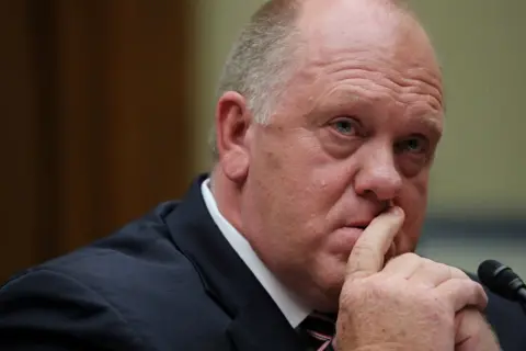 Reuters Head and shoulders pic of Tom Homan with his chin resting on his hands