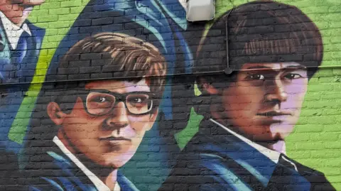 A mural depicting two members of the music group The Zombies 