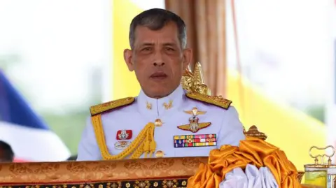 Getty Images Thai King Maha Vajiralongkorn wearing royal uniform decorated with brooches
