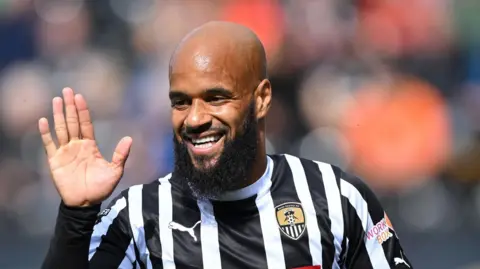 David McGoldrick looks for a high-five after scoring a goal for Notts County