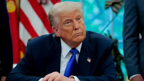Getty Images US President Donald Trump takes a question from a reporter in the Oval Office at the White House on 5 May , 2025 in Washington, DC.