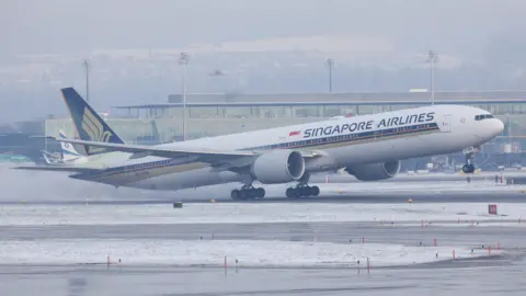 Reuters Singapore Airlines plane landing on the runway