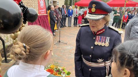 The Lord Lieutenant of Wiltshire, Sarah Troughton, speaking with Head Girl from Zouch Primary School