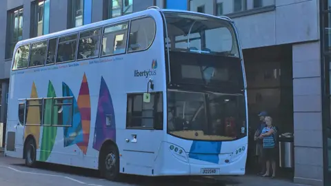 BBC Jersey bus at station