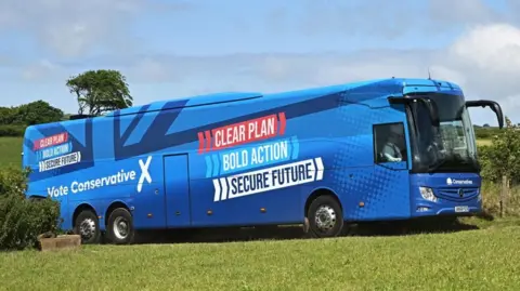 Reuters The Conservatives' campaign bus arrives as the party campaigns on a farm near Barnstaple in North Devon