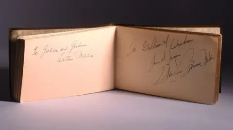 Ewbank's The book with Arthur Miller and Marilyn Monroe's signatures. The first one reads: "To Gillian and Graham, Arthur Miller". The second says: "To Gillian and Graham, Love and Kisses, Marilyn Monroe Miller."