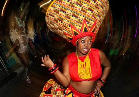 Esa Alexander / Reuters A reveller takes part in the annual Cape Town Carnival in Green Point, Cape Town, South Africa, March 15, 2025. 
