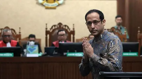 Gojek founder Nadiem Makarim appears in court for the verdict in his high profile corruption trial in Jakarta, Indonesia