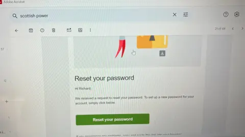 A photograph of an email from Scottish Power, titled "Reset your password". The email begins, "Hi Richard"