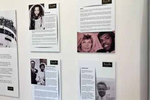 Henry Godfrey-Evans/BBC A display of several black and white photos accompanied by blocks of text.