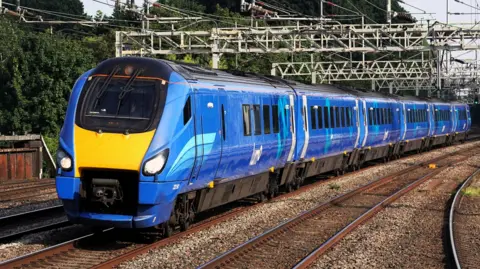 Alstom/Ian Nightingale A blue train with Lumo branding travelling under overhead wires.
