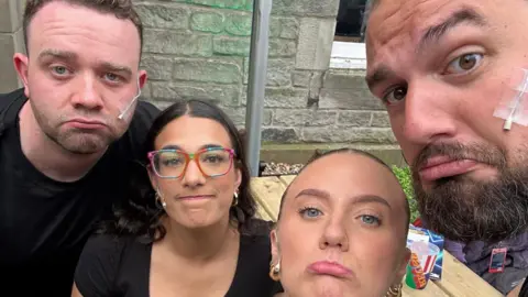 I Love You, You're Perfect, Now Change/X The cast of musical I Love You, You're Perfect, Now Change struck glum poses after their show was abandoned