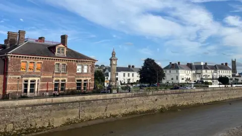 Barnstaple seen from the river with the museum on the left and the clock tower in the centre