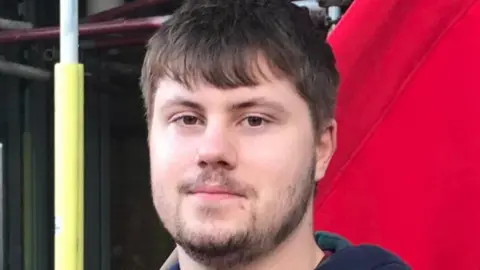 Fraser McGuire Fraser McGuire. Fraser is a 20-year-old man with short brown hair, a short brown beard and brown eyes. He's pictured outside in front of a red background 