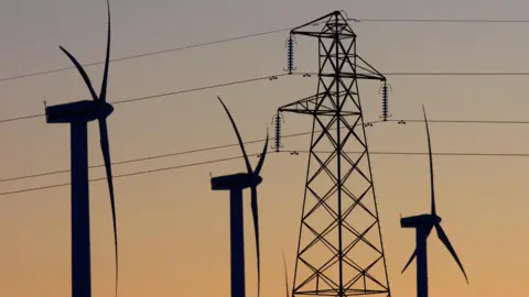 Reuters Electricity pylons and wind turbines at Scottish Power's Dun Law West wind farm near Edinburgh