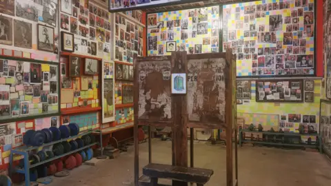 Leslie Holmes The Smiths Room dedicated to the Manchester band at Salford Lads and Girls Club. It features images. memorabilia and messages all over the walls with some gym weights lining the walls.