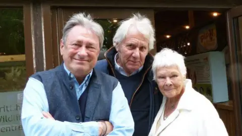 Gardener and broadcaster Alan Titchmarsh with British Wildlife Centre founder David Mills and his partner, actor Dame Judi dench