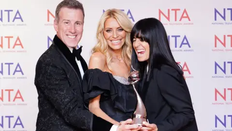 PA Media Anton Du Beke, Tess Daly and Claudia Winkleman holding their award