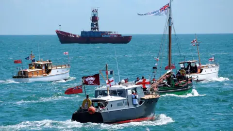 Several original Little Ships of Dunkirk at sea.