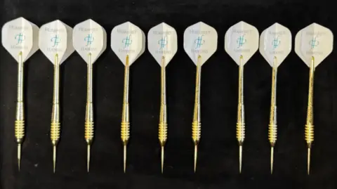 Humphrey and Hawkins Golden darts which say Humphrey and Hawkins on them which is the jeweller.