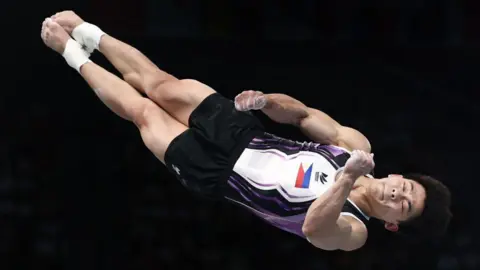 Getty Images Carlos Yulo competing in the Olympics' men's vault final on 4 August 2024