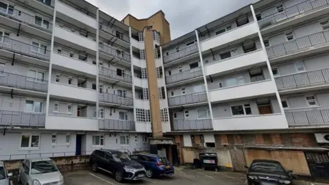 Google  The block of flats in Bermondsey where Kacey Clarke was fatally stabbed. The photo shows the car park area and the white flats with black railings across the balconies.