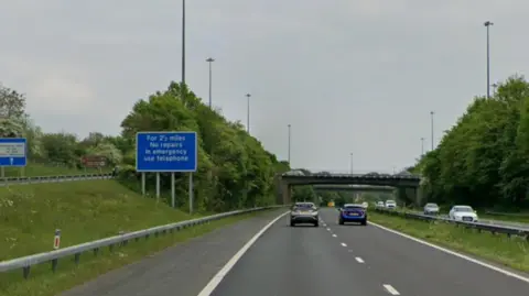 M48, looking towards junction two and a flyover above the carriageway