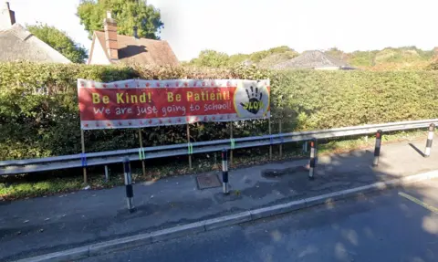 Road safety banner outside Dropmore Infants School, Burnham, Bucks